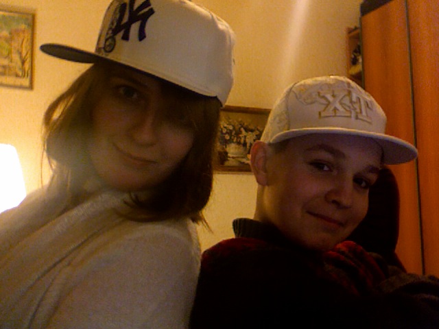 The bestest little brother in the whole world. And yours truly. Modeling hats sold exclusively in Kiev's Hip Hop Shop. 